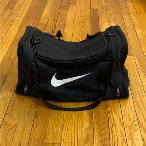 Nike black duffel duffle with white check logo